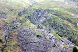 Telephoto shot showing abandoned working face and spoil tips below